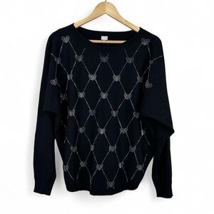 Black knitted sweater with silver hearts